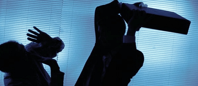 A man is assaulted by a coworker with a briefcase