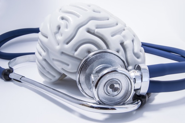A brain with a stethoscope wrapped around it.