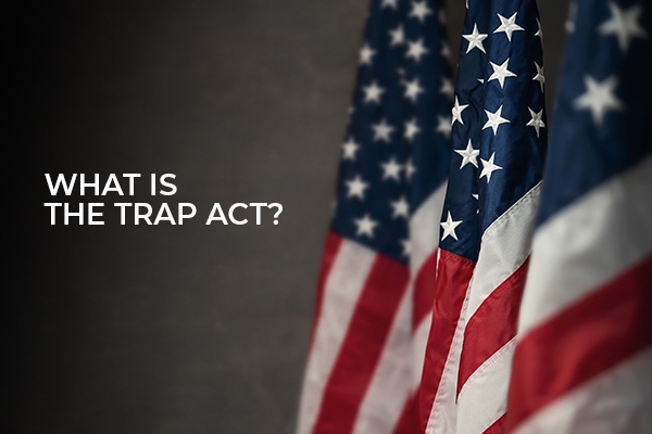 An American Flag with the words, what is the trap act?