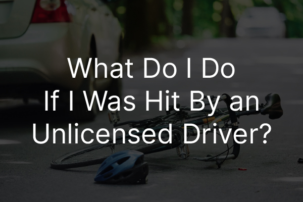 A car accident with the words, "what do I do if I was it by an unlicensed driver."