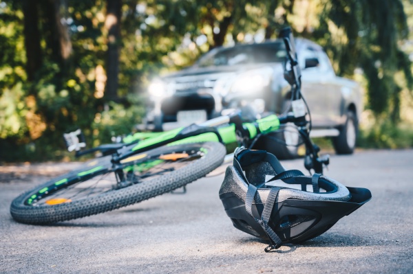 A picture of a bicycle accident on a backroad.