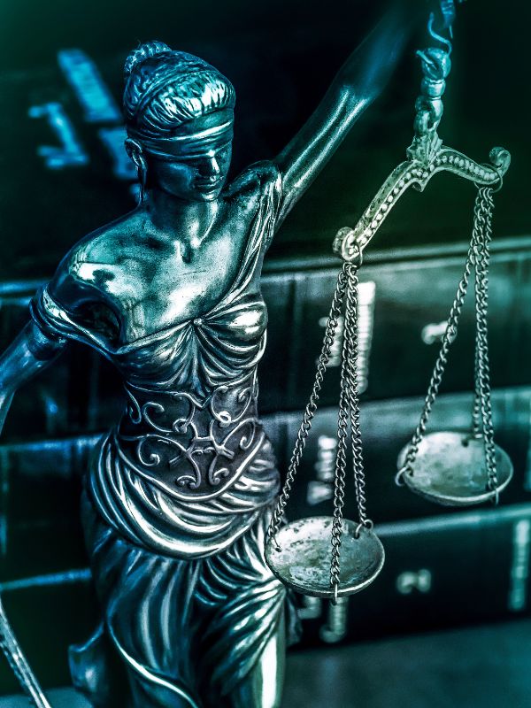 Justice scales and a stack of legal books. 