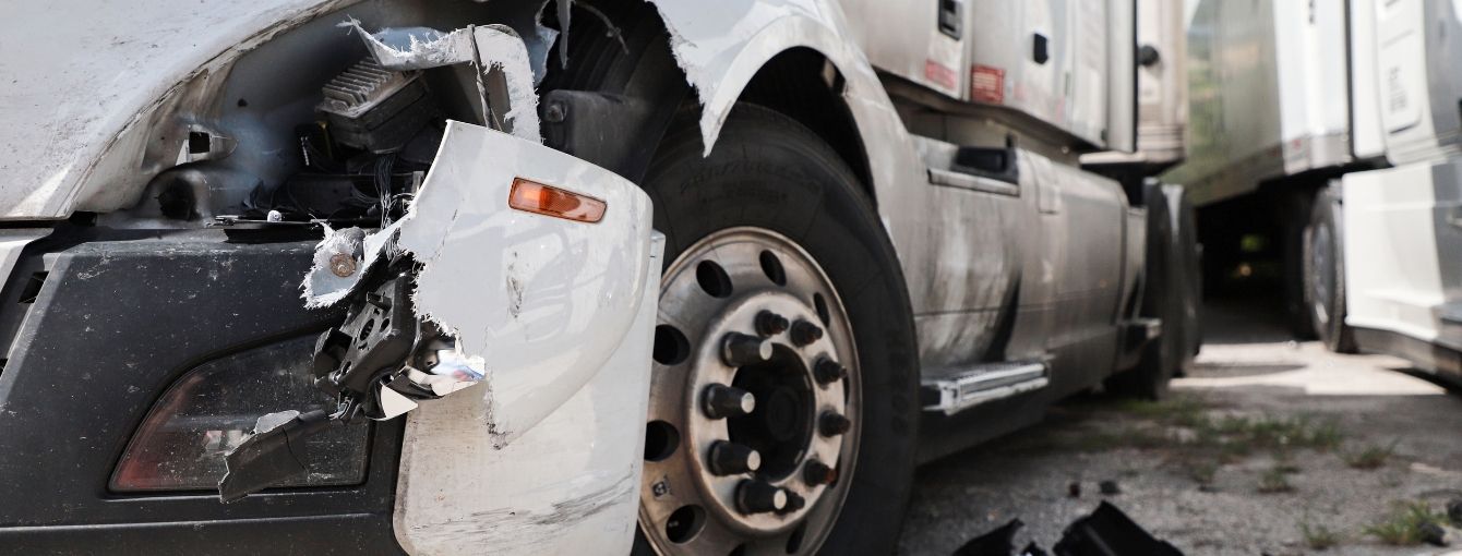 A close-up of damage to a truck after a truck accident.